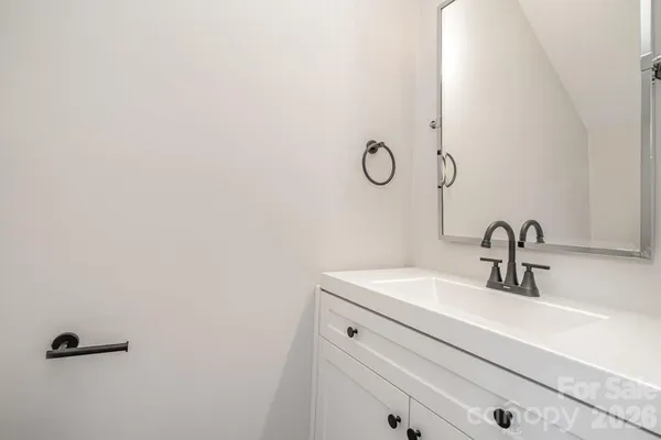 a bathroom with a sink and mirror