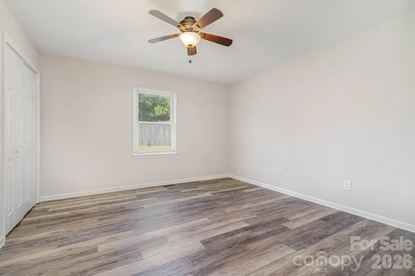 a view of workspace with wooden floor and window