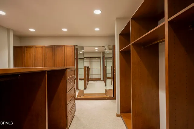 a spacious bathroom with a granite countertop tub sink and mirror