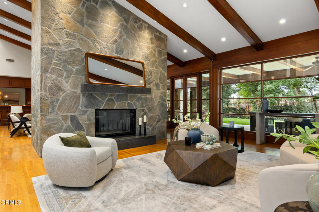 921 Chapea Road Pasadena, CA 91107 - Photo 6 of 22 a living room with furniture and a fireplace