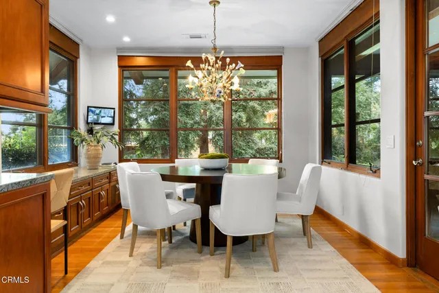 a view of a livingroom with furniture window and wooden floor