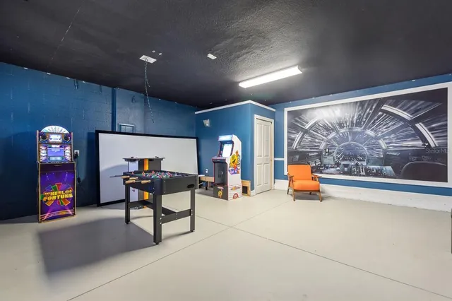 an aerial view of a house with a swimming pool yard and outdoor seating