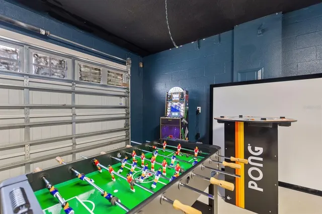 an aerial view of a swimming pool patio yard and outdoor seating