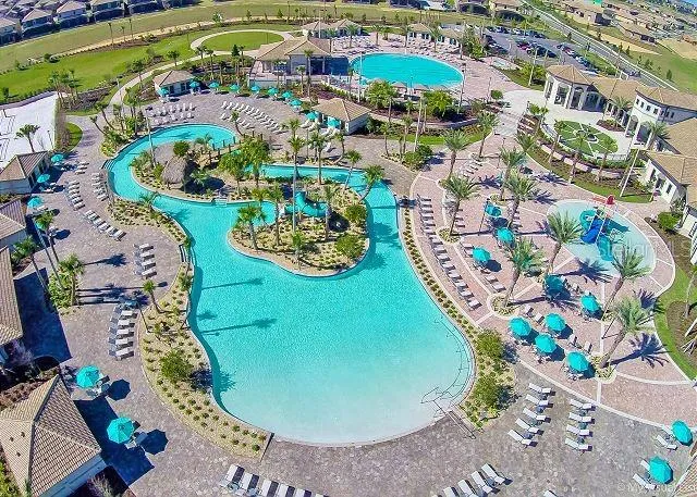a view of swimming pool with outdoor seating and yard