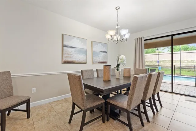 a living room with furniture kitchen view and a table
