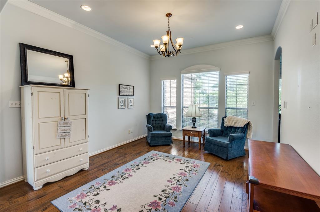 336 Maggie Street Canton, TX 75103 - Photo 11 of 30 a living room with furniture and a chandelier