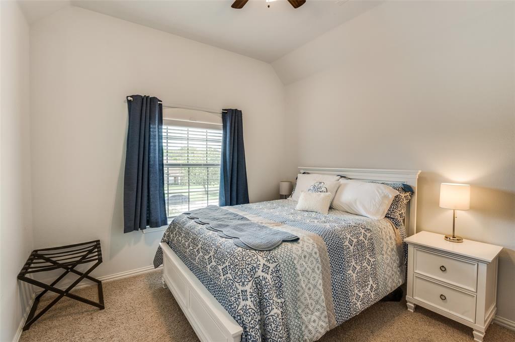 336 Maggie Street Canton, TX 75103 - Photo 18 of 30 a bedroom with a bed and a window