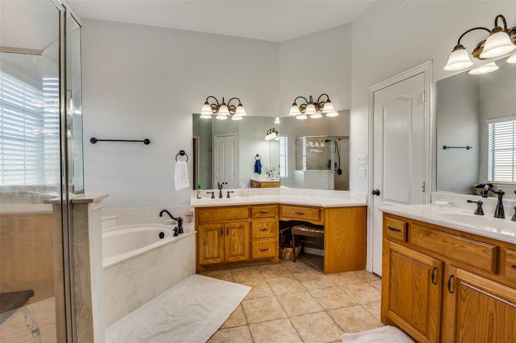 336 Maggie Street Canton, TX 75103 - Photo 26 of 30 a large bathroom with a large tub sink and double vanity