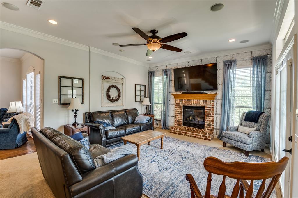 336 Maggie Street Canton, TX 75103 - Photo 10 of 30 a living room with fireplace furniture and a flat screen tv
