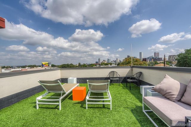 a view of a lake with outdoor seating