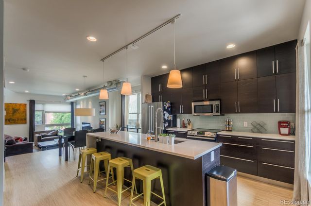 a kitchen with a sink cabinets and window
