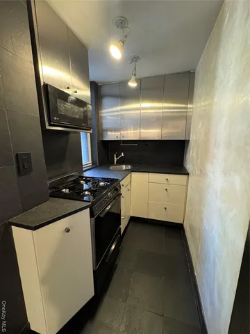 a kitchen with a stove and a sink