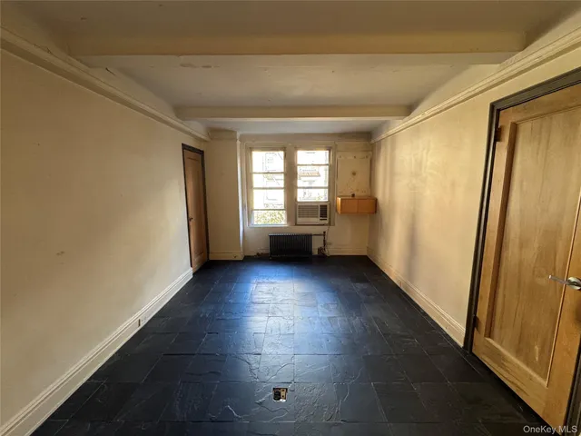 a view of empty room with windows