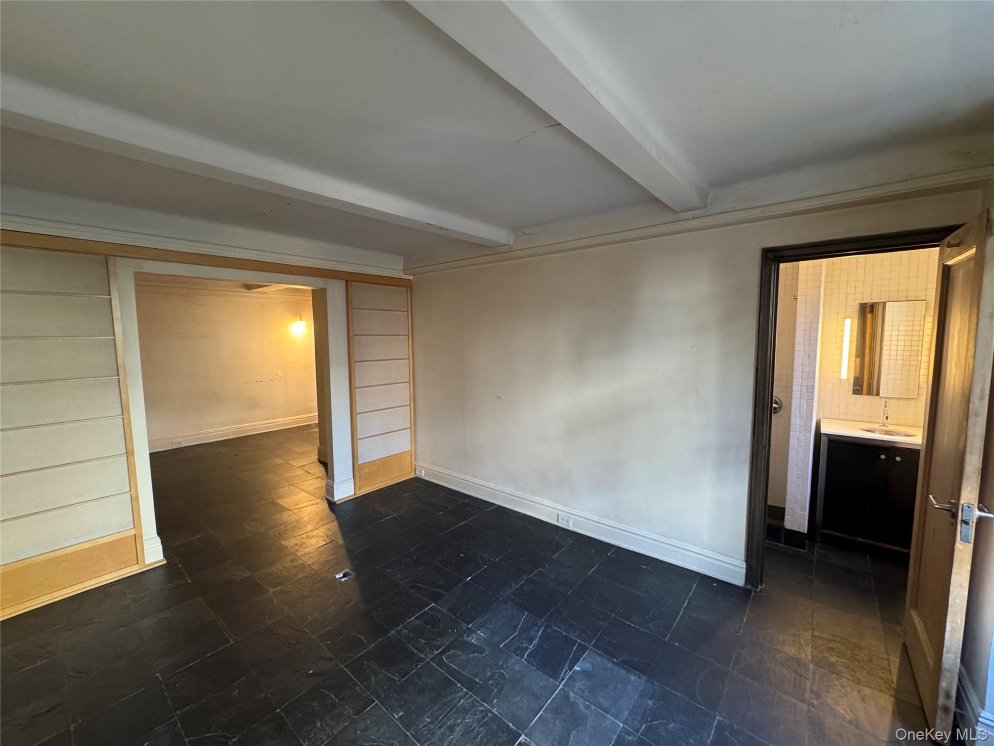 333 East 53rd Street, Unit 5C Manhattan, NY 10022 - Photo 19 of 27 an empty room with wooden floor and windows