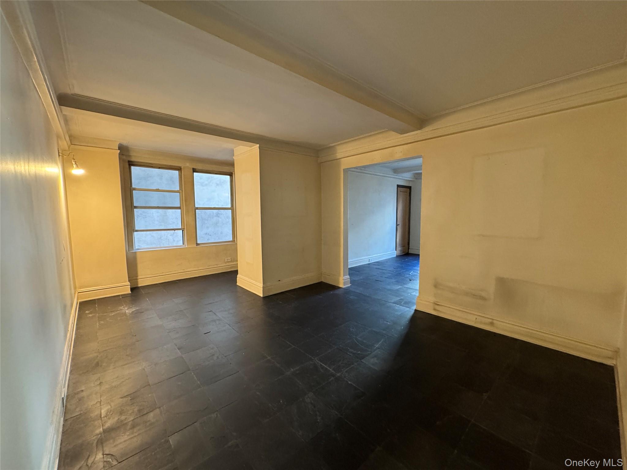 333 East 53rd Street, Unit 5C Manhattan, NY 10022 - Photo 22 of 27 an empty room with wooden floor and windows