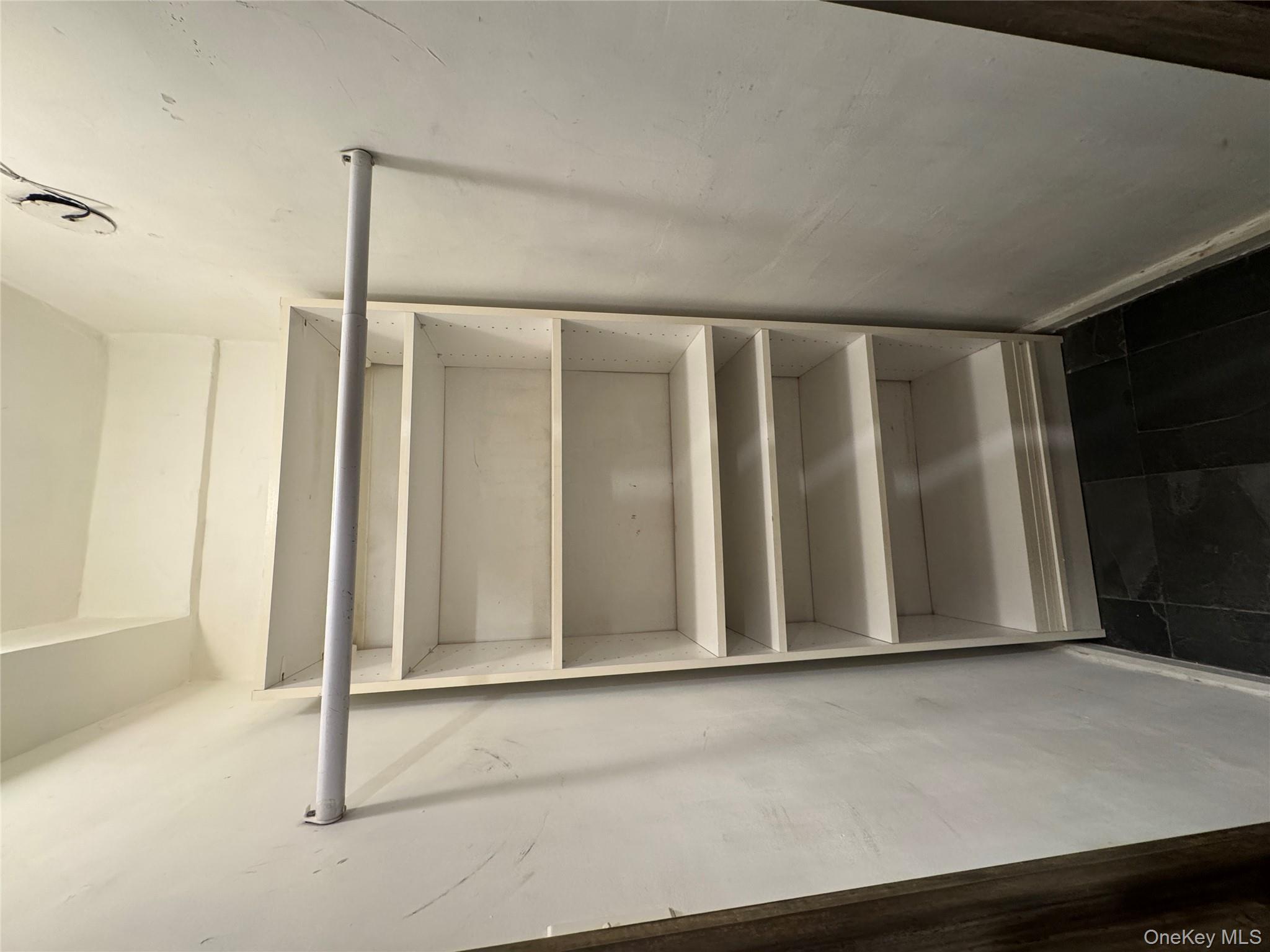 333 East 53rd Street, Unit 5C Manhattan, NY 10022 - Photo 25 of 27 a view of walk in closet with empty racks