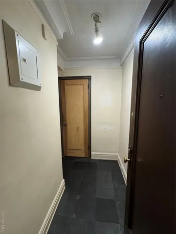 wooden floor in a hall with a mirror