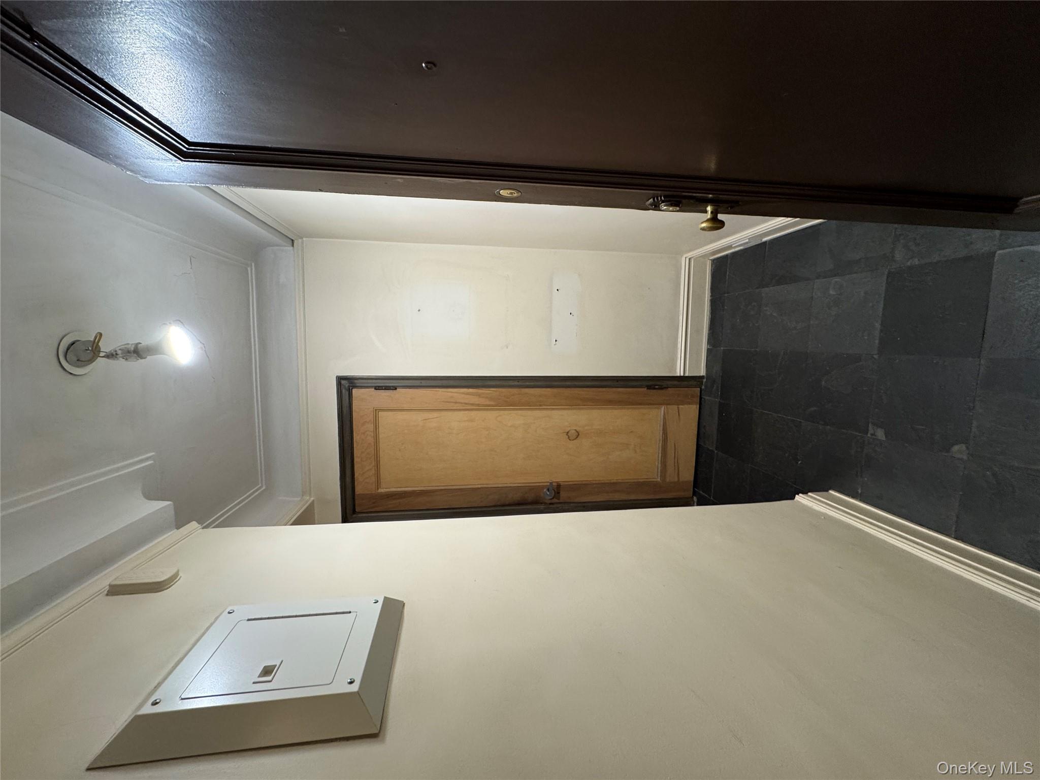 333 East 53rd Street, Unit 5C Manhattan, NY 10022 - Photo 27 of 27 wooden floor in a hall with a mirror