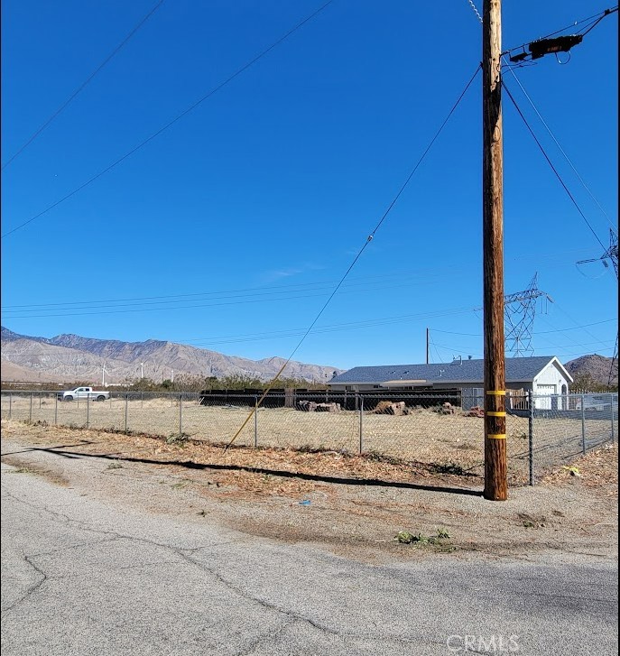 a view of a road with an ocean view