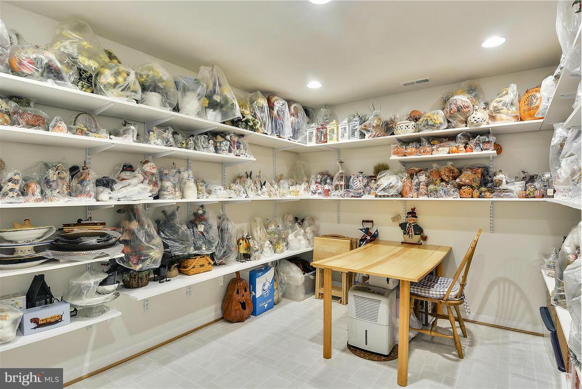 10839 Moore Drive Manassas, VA 20111 - Photo 24 of 30 a room with granite countertop lots of clutter and chairs