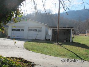 158 Howell Cove Road Canton, NC 28716 - Photo 3 of 14 a front view of a house with a yard