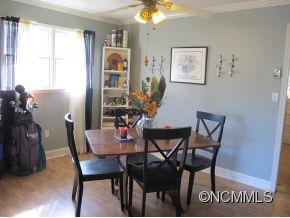 158 Howell Cove Road Canton, NC 28716 - Photo 6 of 14 a view of a dining room with furniture and window
