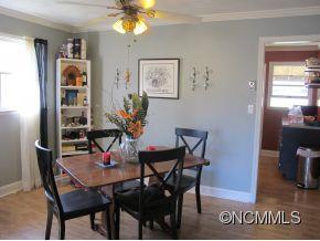 158 Howell Cove Road Canton, NC 28716 - Photo 7 of 14 a view of a dining room with furniture and chandelier