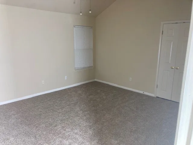 an empty room with a empty space and window
