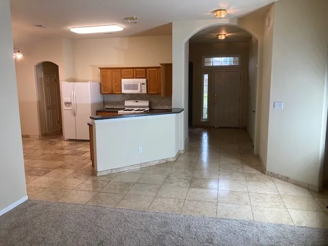 a view of a kitchen with kitchen and a sink
