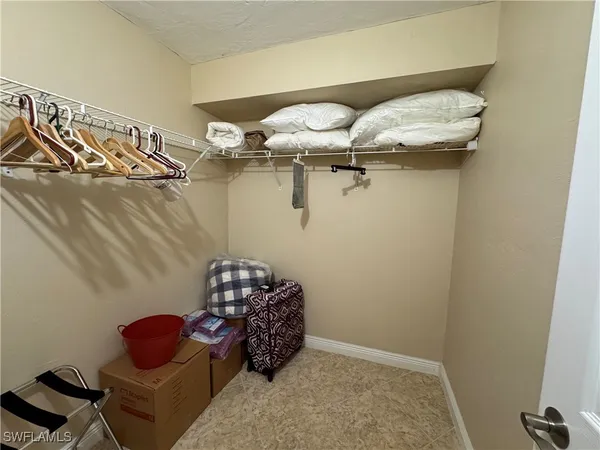 a bed room with a bed and gym equipment