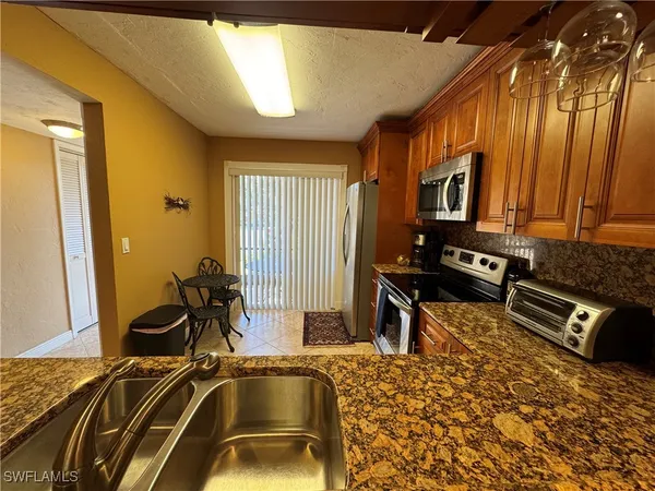 a view of a livingroom with furniture and windows
