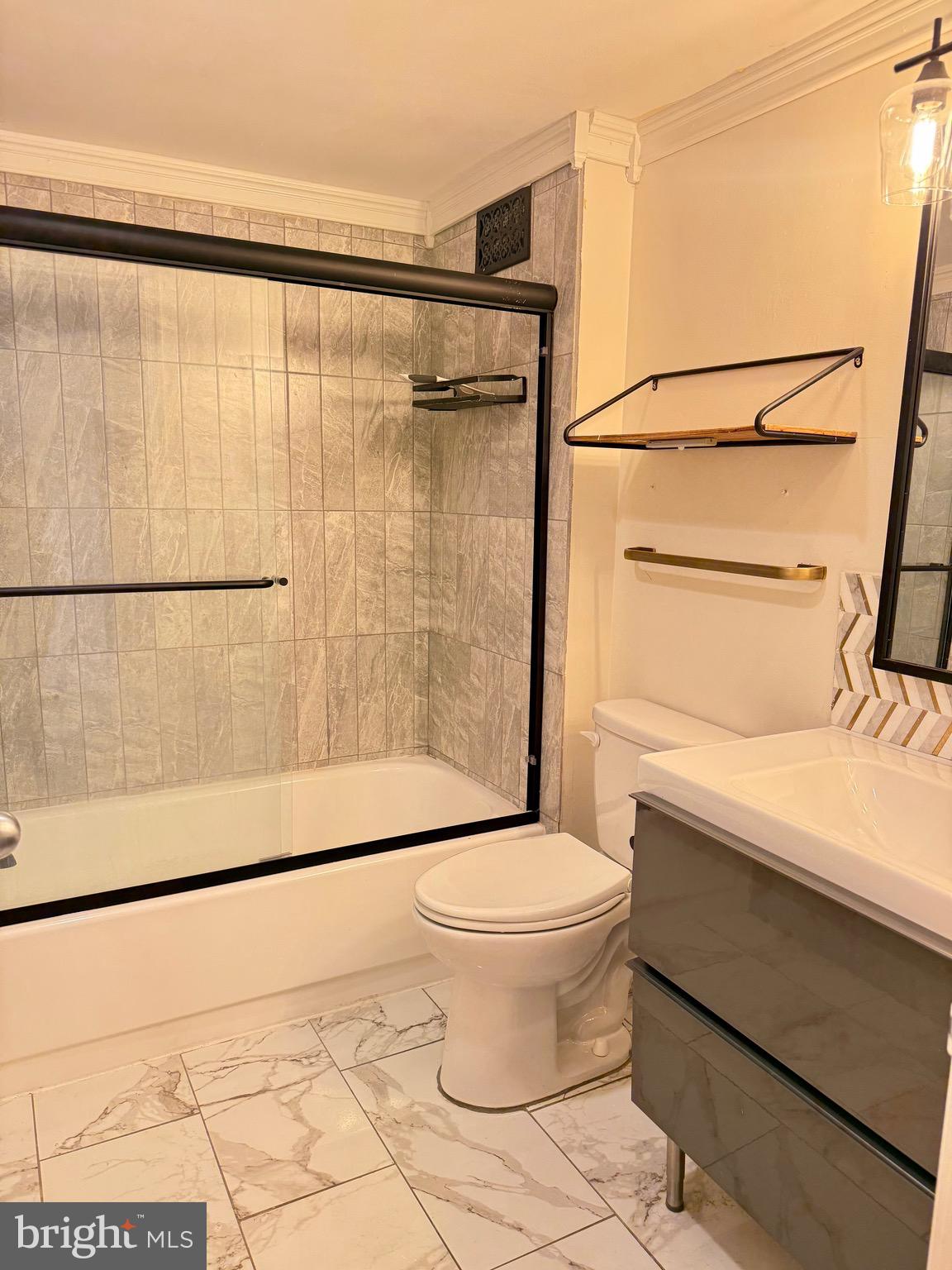 5300 Holmes Run Parkway, Unit 1012 Alexandria, VA 22304 - Photo 11 of 12 a bathroom with a toilet and a shower