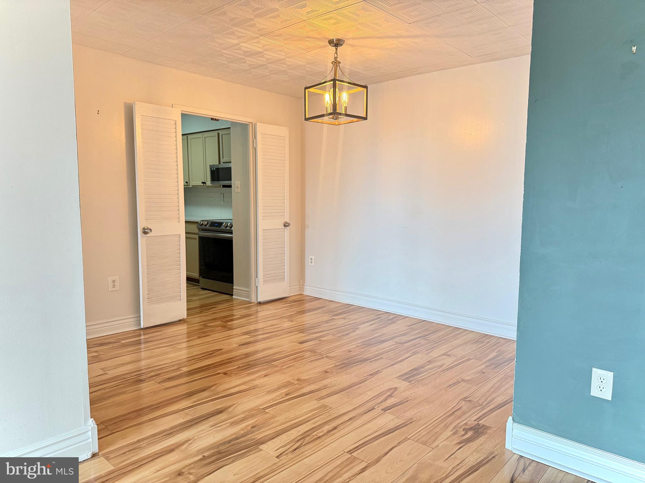 5300 Holmes Run Parkway, Unit 1012 Alexandria, VA 22304 - Photo 4 of 12 a view of a room with wooden floor and natural light