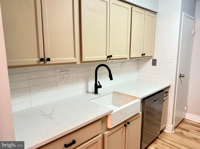 a kitchen with a sink and cabinets