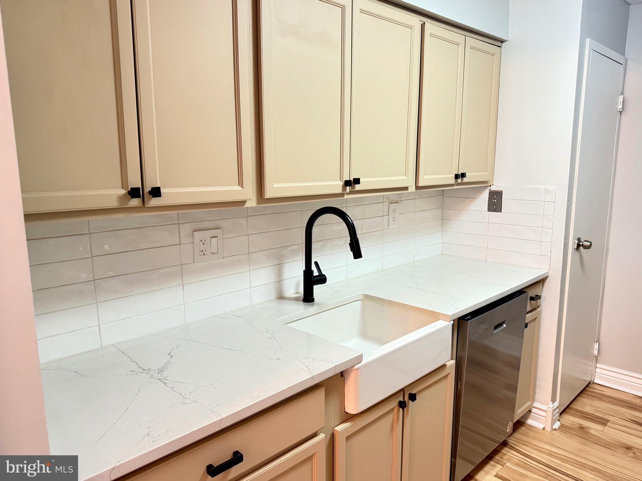 5300 Holmes Run Parkway, Unit 1012 Alexandria, VA 22304 - Photo 6 of 12 a kitchen with a sink and cabinets