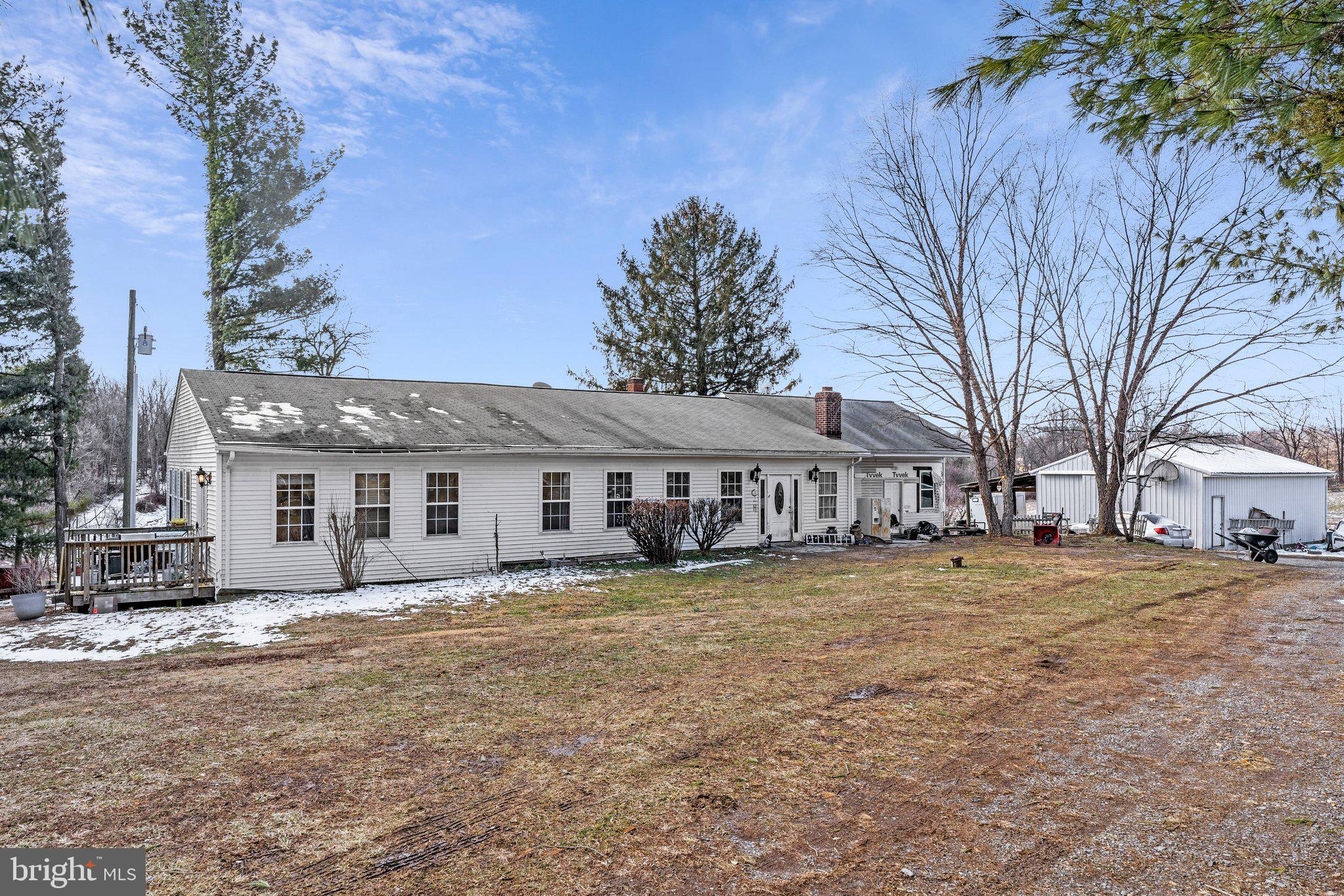 14757 Beamertown Road Purcellville, VA 20132 - Photo 1 of 28 a view of a house with a yard covered in snow