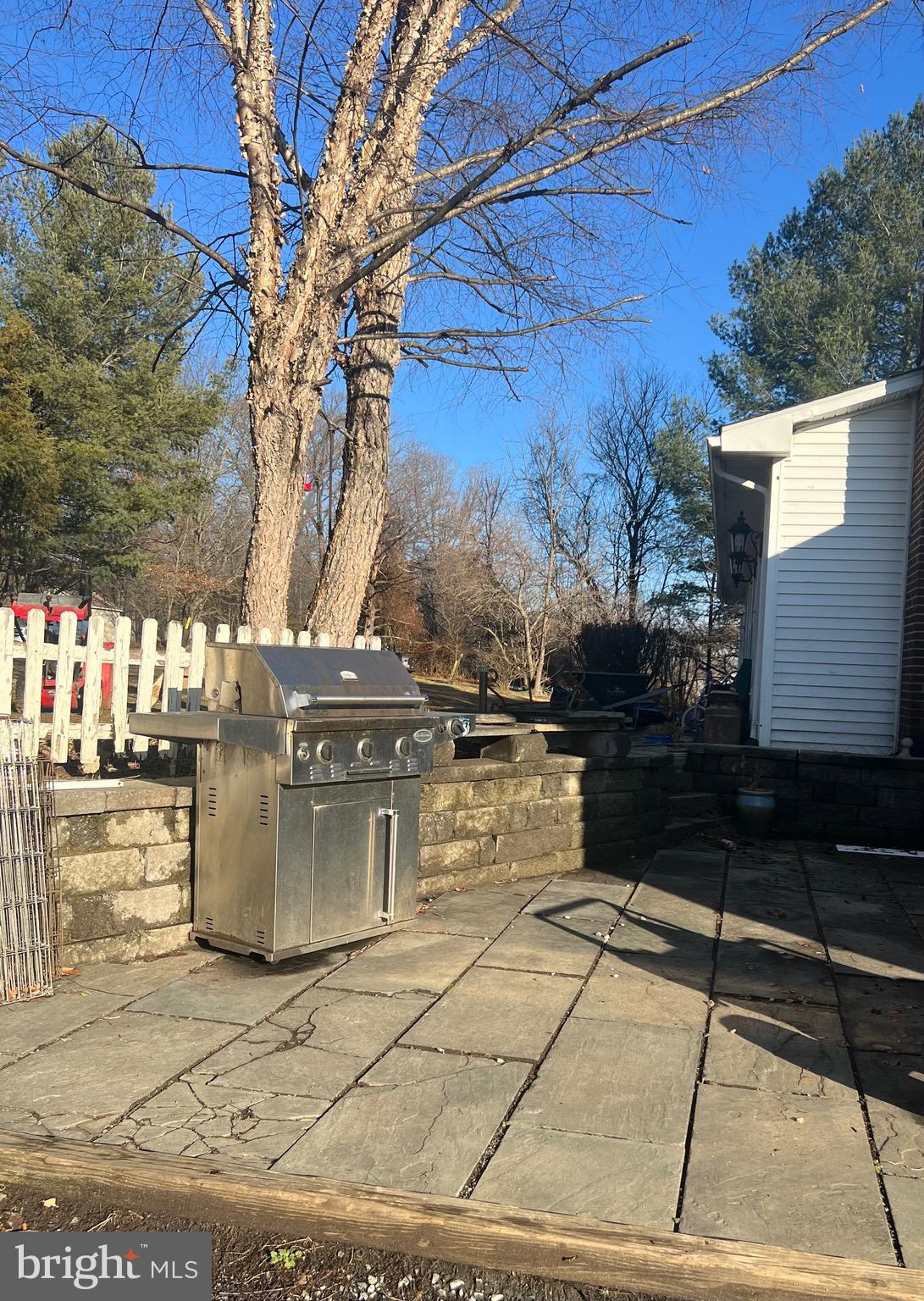 14757 Beamertown Road Purcellville, VA 20132 - Photo 5 of 28 a view of a patio with table and chairs with wooden floor and fence