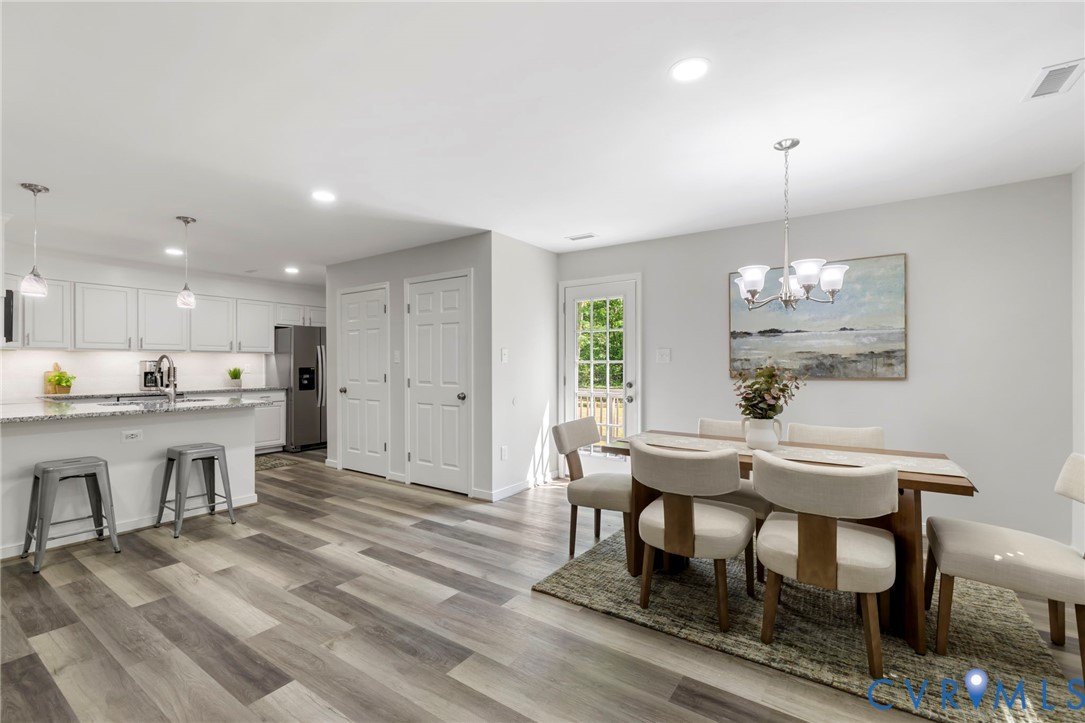 10401 Reedy Branch Road Chesterfield, VA 23838 - Photo 7 of 29 Dining Room to Kitchen with Pantry and Laundry Clo