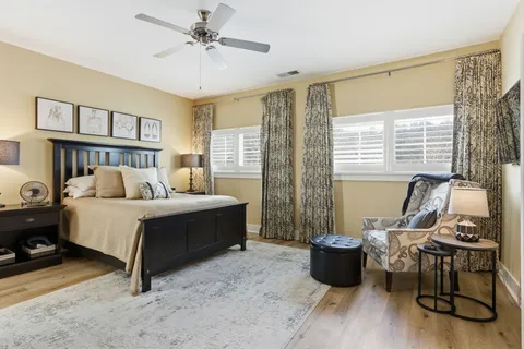 a bed room with furniture and a window