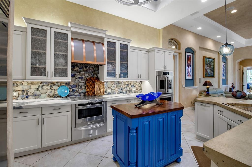 8116 Lone Tree Glen Lakewood Ranch, FL 34202 - Photo 12 of 48 a kitchen with a stove sink and cabinets