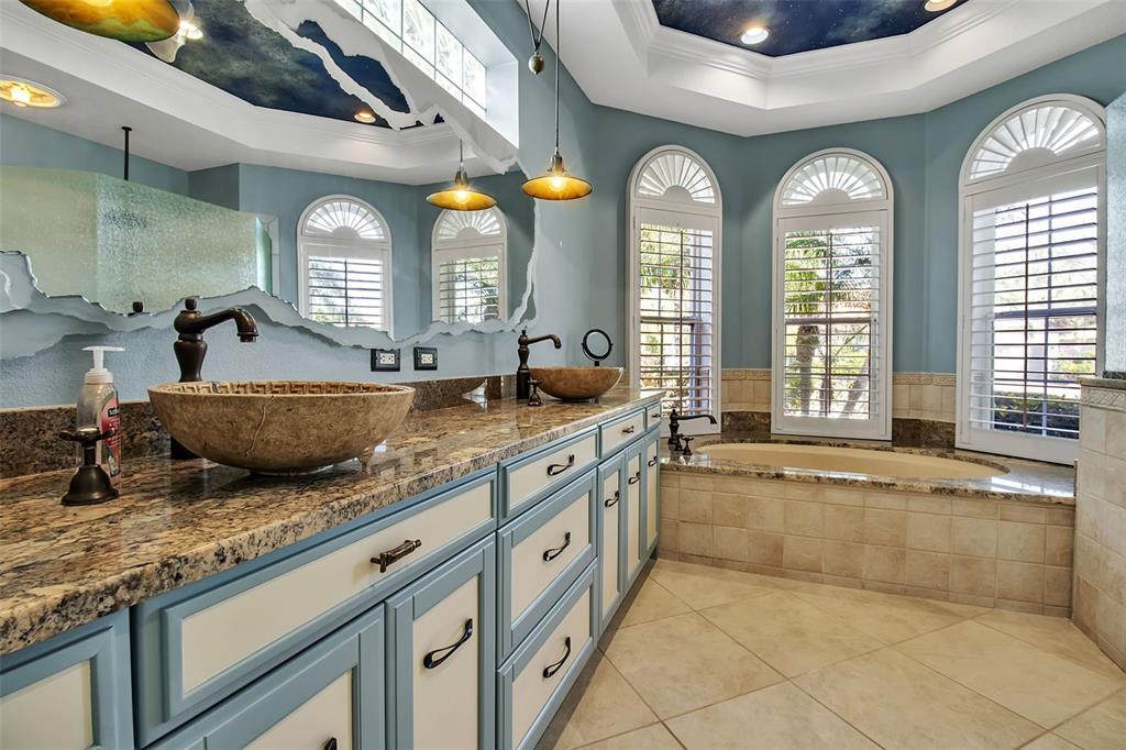 8116 Lone Tree Glen Lakewood Ranch, FL 34202 - Photo 21 of 48 a bathroom with double vanity and a large mirror