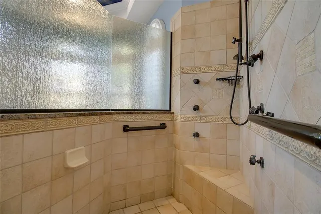 a view of walk in closet with washer and dryer