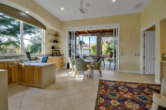 a kitchen with stainless steel appliances granite countertop a sink a stove and a refrigerator