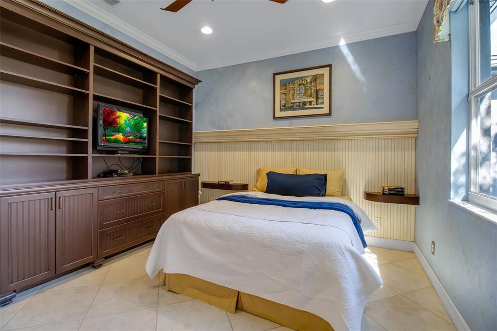 8116 Lone Tree Glen Lakewood Ranch, FL 34202 - Photo 35 of 48 a bedroom with a bed and a window