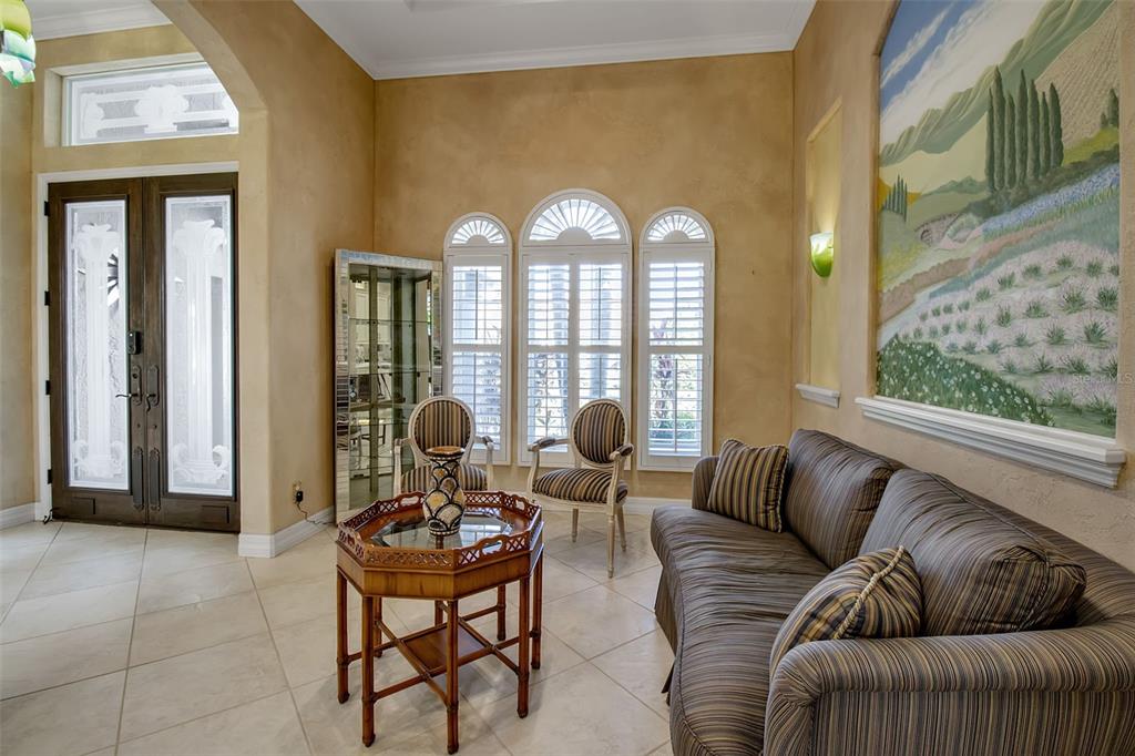 8116 Lone Tree Glen Lakewood Ranch, FL 34202 - Photo 6 of 48 a living room with furniture and a large window
