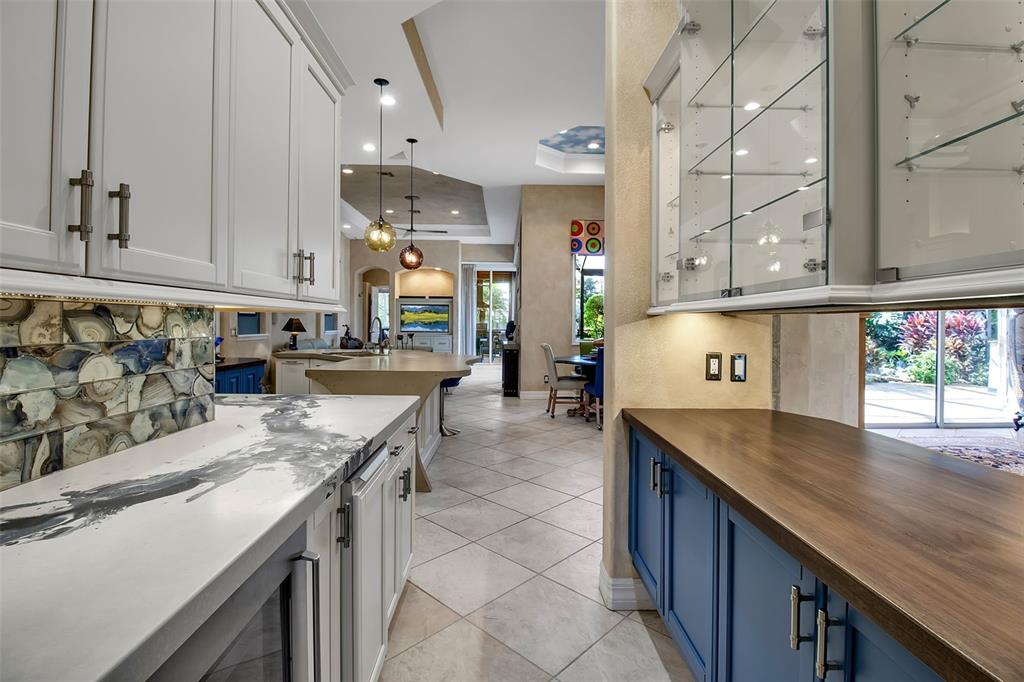 8116 Lone Tree Glen Lakewood Ranch, FL 34202 - Photo 8 of 48 a kitchen with stainless steel appliances granite countertop a sink stove and cabinets