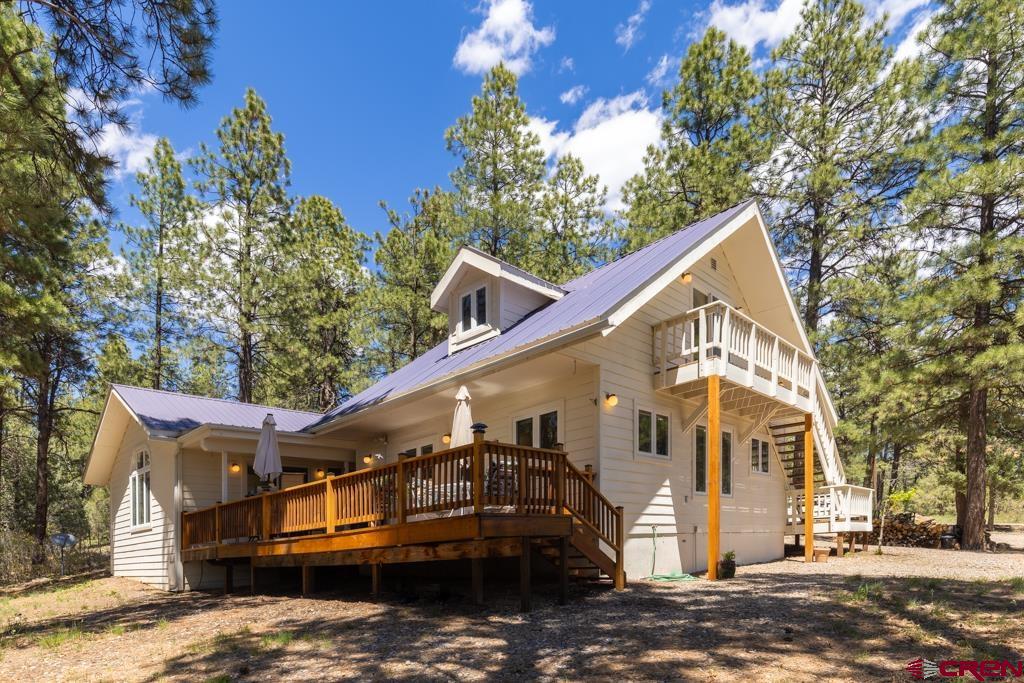 171 Deer Trail Road Durango, CO 81303 - Photo 1 of 35 a view of a house with a yard