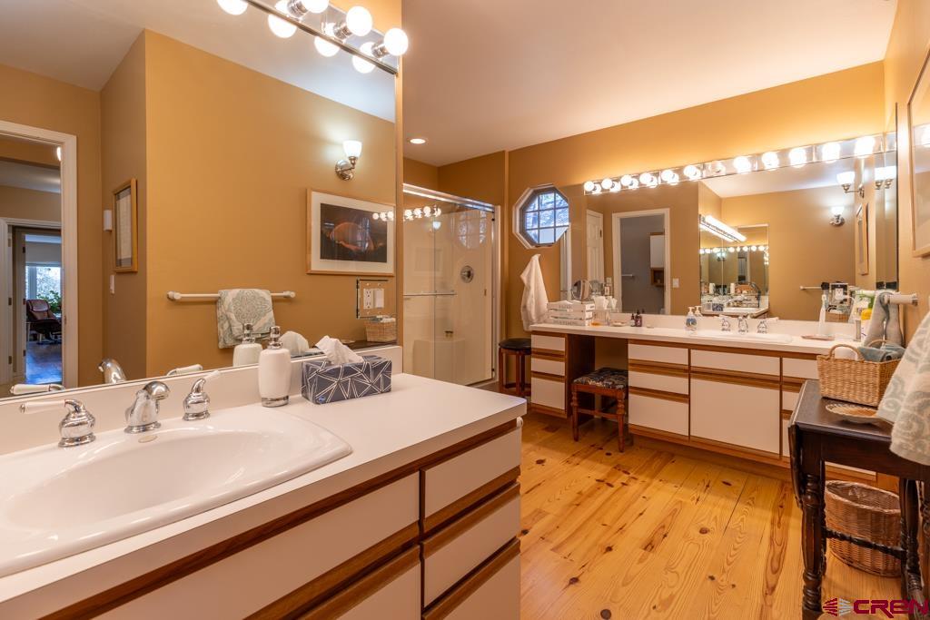 171 Deer Trail Road Durango, CO 81303 - Photo 17 of 35 a bathroom with a sink double vanity and a mirror