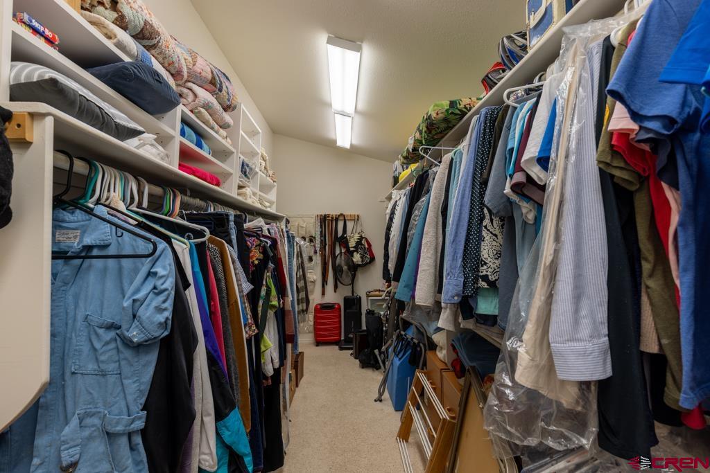 171 Deer Trail Road Durango, CO 81303 - Photo 18 of 35 a view of walk in closet with clothes and shoes
