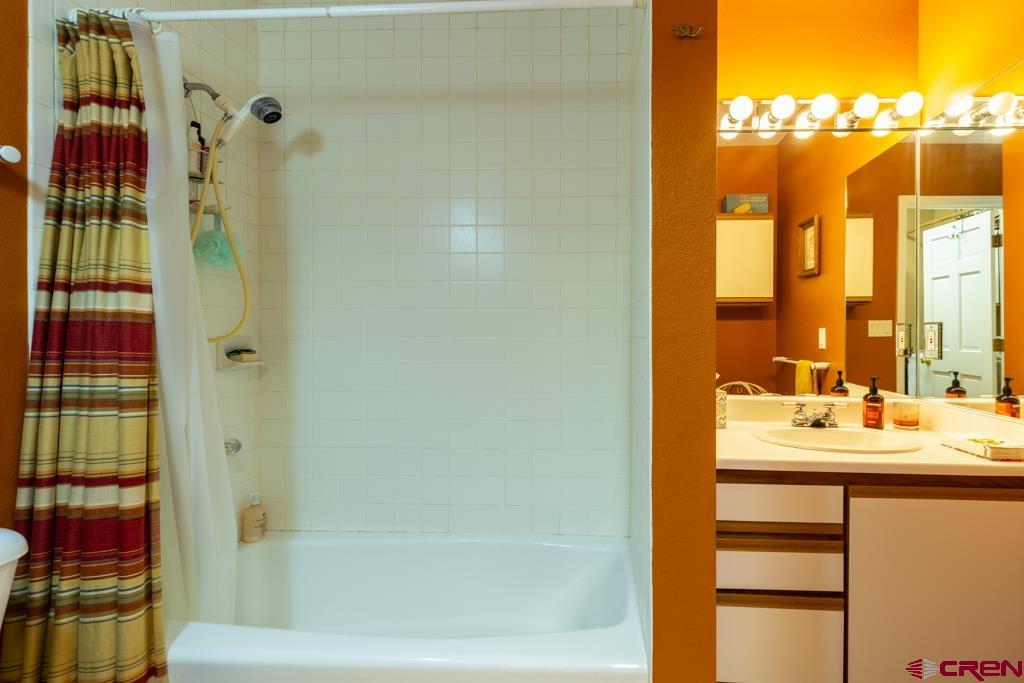 171 Deer Trail Road Durango, CO 81303 - Photo 20 of 35 a bathroom with a sink and a mirror
